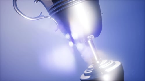 Elegant Silver Trophy Rotating with Glowing Light Rays