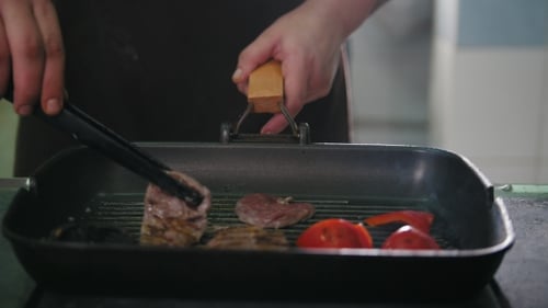 Food Cooking in a Grill Pan Inside Kitchen
