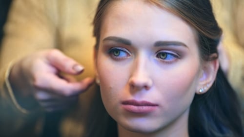 Hands of Hairdresser at Beauty Salon, Curling Female Hair