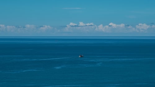 Fishing Boat in Blue Sea, Fishing Vessel Underway To Fishing Harbour