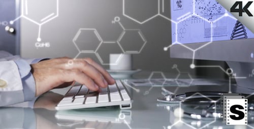 Medical Professional Typing with Graphics Overlay