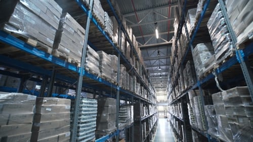 Camera Moving Between Palettes with Ordered Goods and Materials at Warehouse