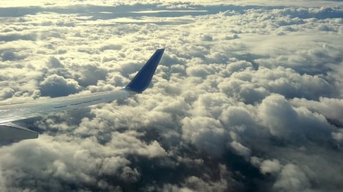 Clouds From an Airplane Window on Sunny Day