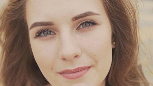 Attractive Woman Smiling in Close Up Portrait