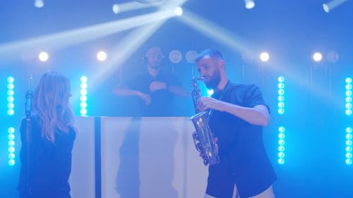 Musical Band Group of Vocalist Saxophonist Dj Playing Song Performing on Musician Concert Stage