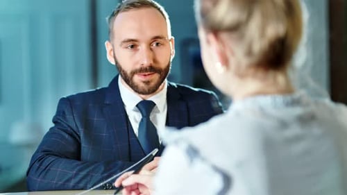 Portrait of Smiling Male Businessman Arrived at Hotel Having Business Trip Registering on Reception