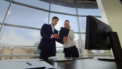 Two Young Men Working in the Office
