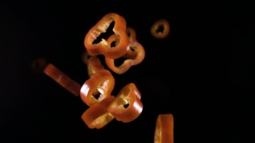 Creative Concept with Flying Red Paprika Sliced Floating Pepper Isolated Levity Capsicum Vegetable