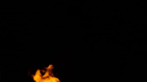 Burning Flames Against Black Backdrop
