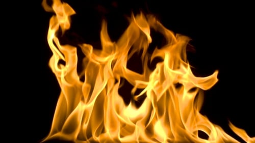 Fire and Flames Burning on a Reflective Glass Surface, in with a Black Background, with the Flame