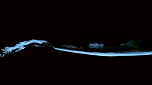 Clear Water Surface on a Black Blue Ripple