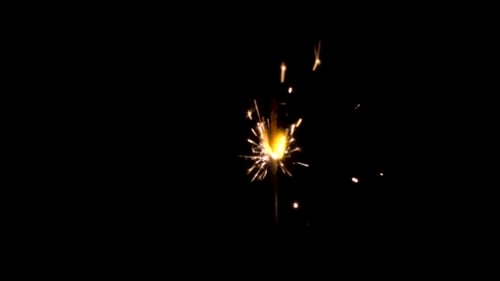 Brilliant Gold Sparks Erupting from Sparkler