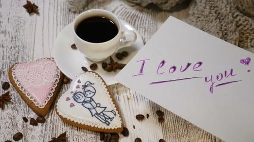 Couple Relations St Valentine Day Concept A Cup of Coffee and Ginger Biscuit with Knitting Needle