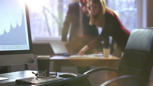 Colleagues Man and Woman Emotionally Discussing Business Plans in an Office