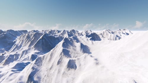 Flying Over Snow-Covered Mountain Range on a Sunny Day