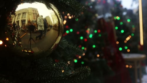 Shiny Ornament Reflects Festive City Scene