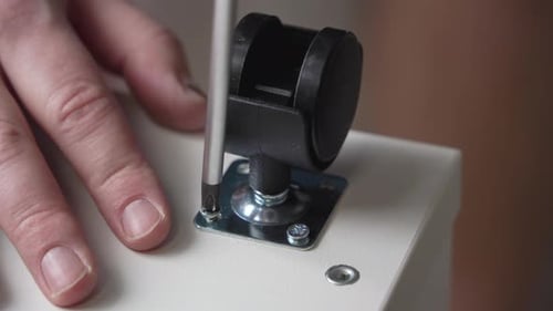 Attaching Caster Wheel to Furniture with Screwdriver