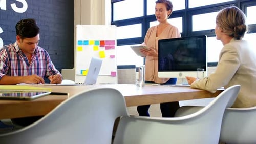 Dynamic Business Meeting in Modern Office Space