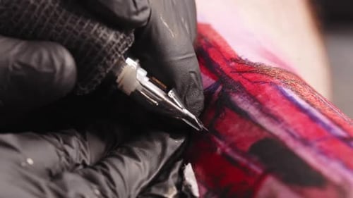 Doing a Tattoo Tattooing the Letters Over Red Sketch