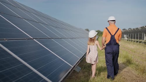 A Father Working in a Solar Power Plant Tells His Daughter About His Work Shows