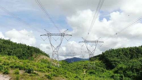 Zoom Out Electricity Transmission Power Lines Pass Through The Forest.