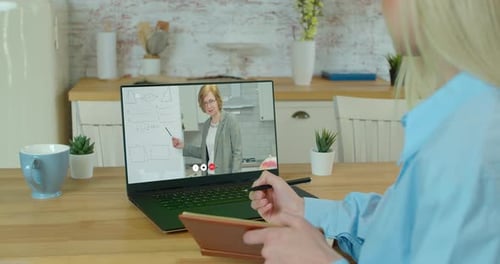 Woman Attending Online Class at Home