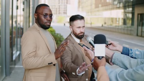 Men Give Press Conference on Urban Sidewalk