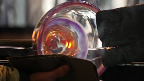 Glass Blower Shaping Red Hot Spiral Glass