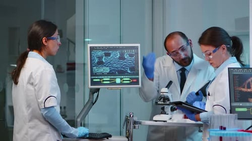 Scientists Working Together in Modern Lab