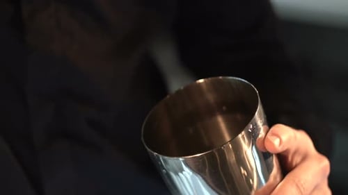 Ice Cubes Dropped into Cocktail Shaker Close Up