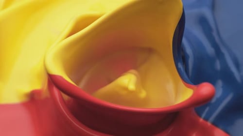 Paint bouncing and making splashes. Slow Motion. Unedited version is included at the end of clip.