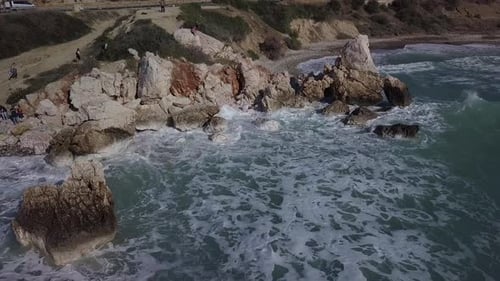 Aerial View of Crashing Waves on Rocks