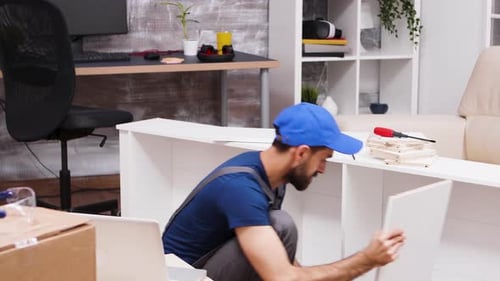 Man Assembling Furniture at Home