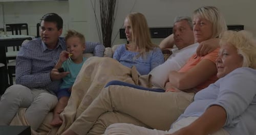 Family Relaxing Together on a Comfortable Couch at Home