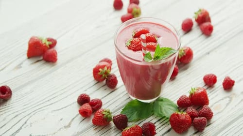 Strawberry Raspberry Smoothie on a White Wooden Table