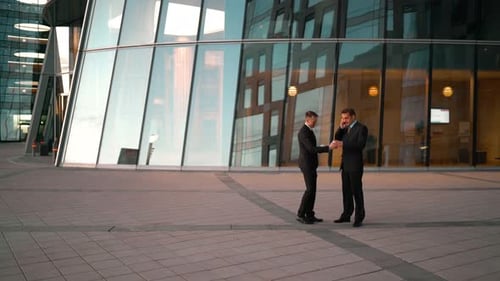 Men in Suits Walking Outside Office Building