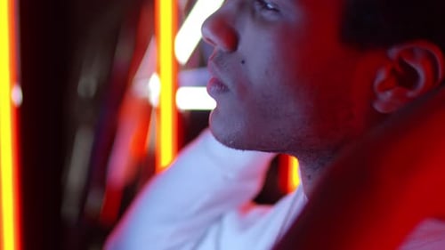 Portrait of Young Man Taking off Hood