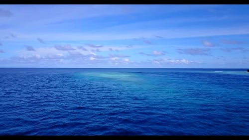 Aerial above scenery of tranquil coastline beach time by blue green lagoon and white sand background