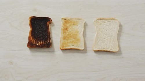 Three Slices of Toast, Toasted to Different Degrees