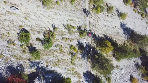 Aerial drone view of a group of mountain bikers on a singletrack trail