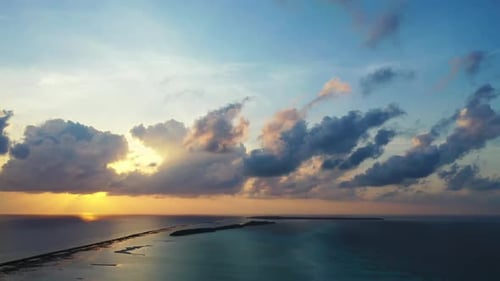 Aerial above texture of idyllic lagoon beach holiday by blue green sea and white sandy background of