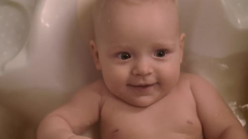 Happy Baby Taking a Bath