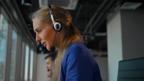 Young Businesswoman Talking on Headset with Perfect Smile.