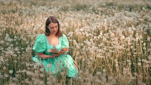 Woman Reads in Field of Dandelions, Turquoise Dress