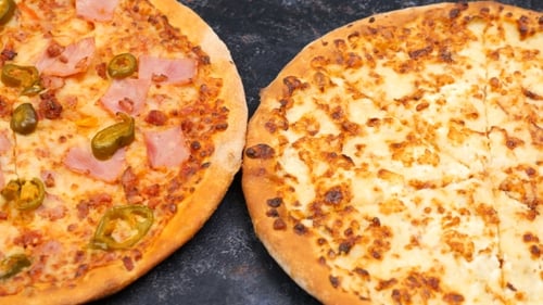 Pan From Right To Left on Three Homemade Pizzas