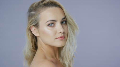 Attractive Blonde Woman Posing in Studio Close-up