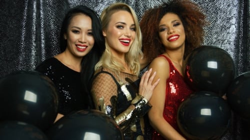 Glamorous Women Smiling at Party with Balloons