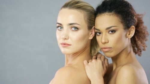 Two Charming Young Women Posing in Studio