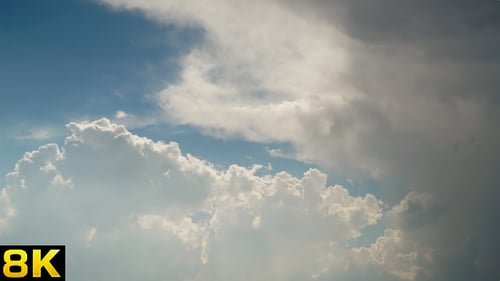 Billowing Clouds Time Lapse Against Blue Sky