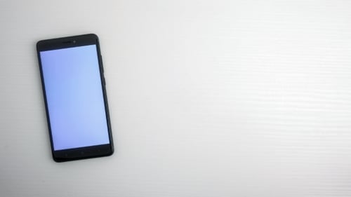 Coins Stack on Phone Screen, Digital Finance Concept